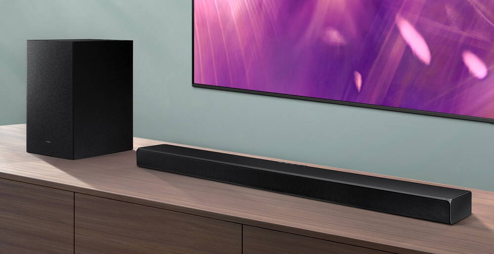 A650 Soundbar and subwoofer are positioned next to Crystal UHD TV.
